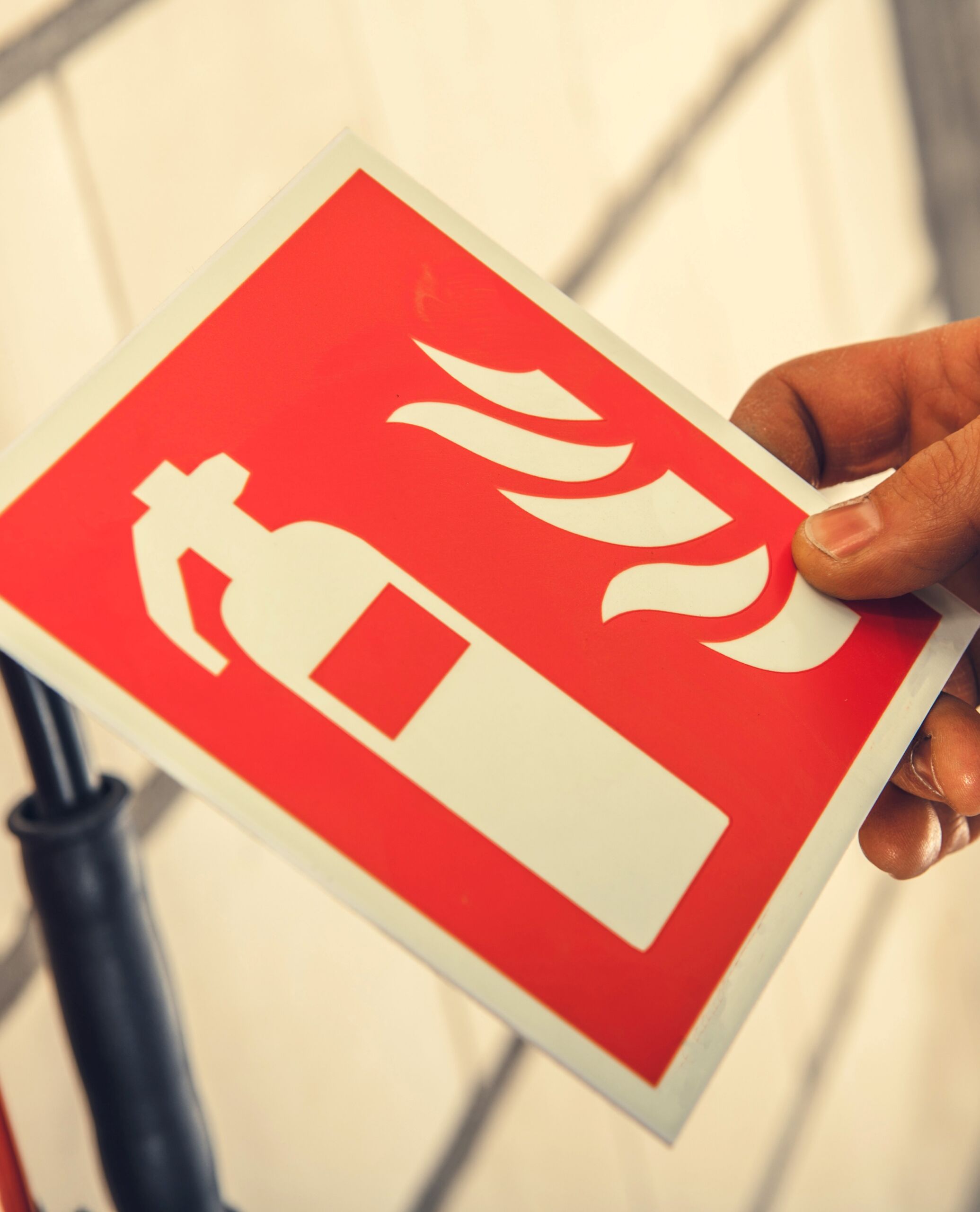 Closeup of Fire Safety Label Illustrating Extinguisher Sign for Equipment Placement Indication.